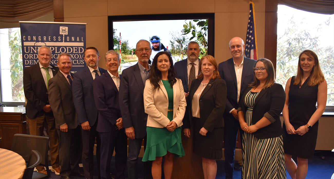 Group of people at a UXO caucus event